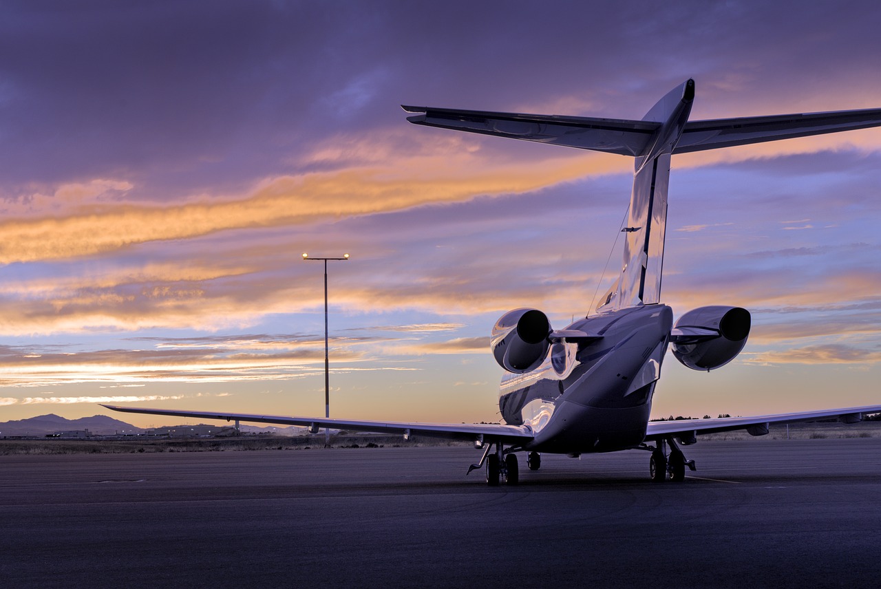 eTA on a private jet or charter to Canada: a small business jet parked on the apron at dusk