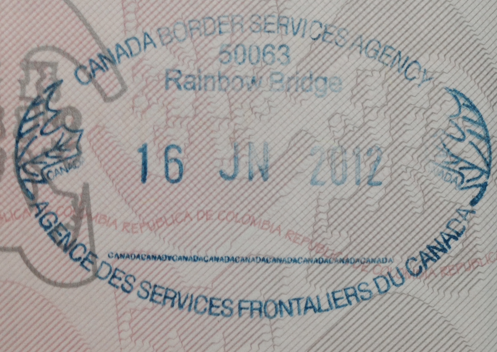 Close-up of a passport page with a blue Canada Border Services Agency stamp dated June 16, 2012, at Rainbow Bridge.
